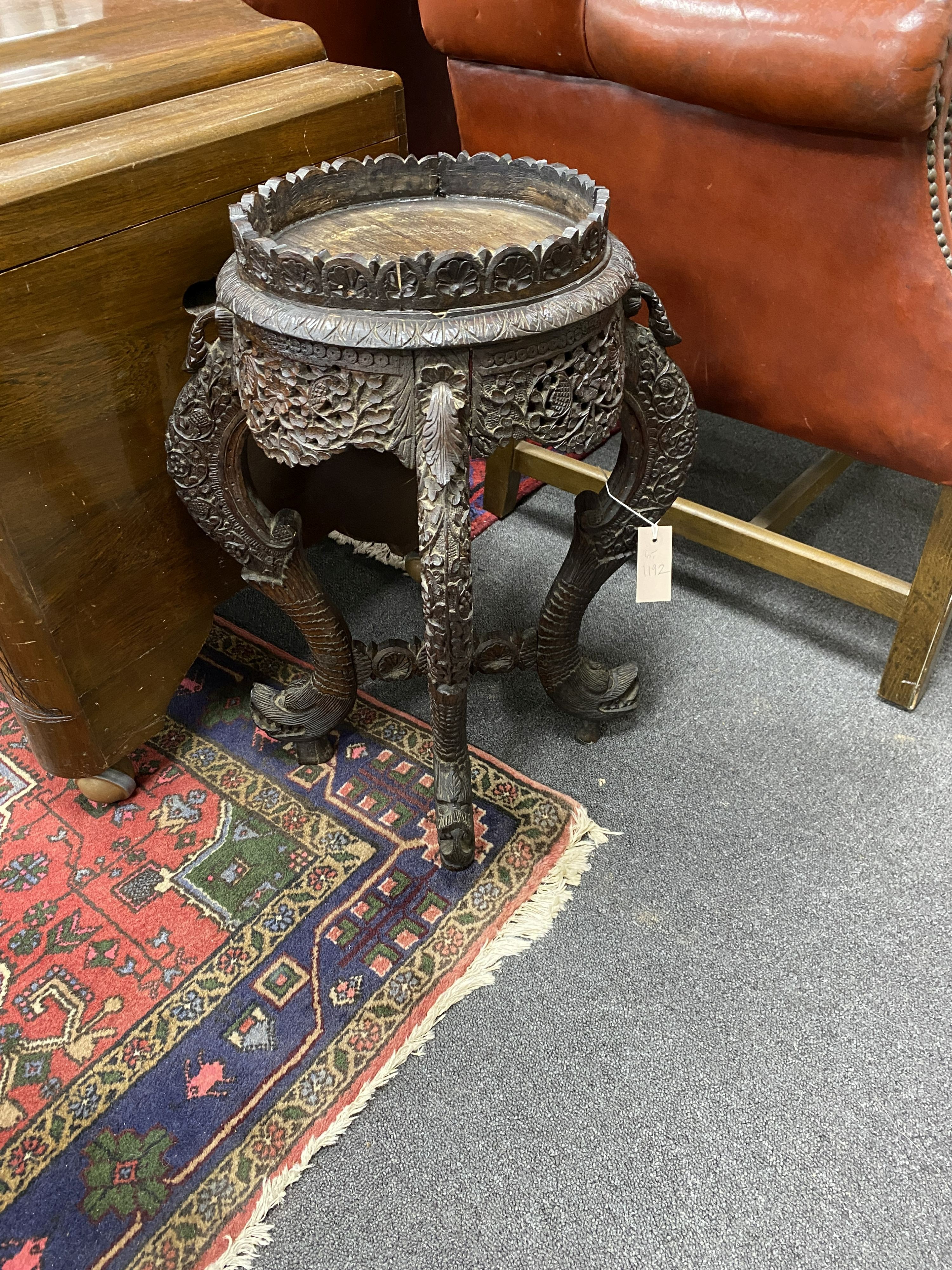 A Burmese carved hardwood jardiniere stand